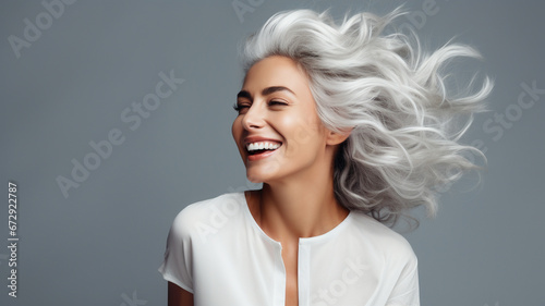 Attractive elderly mature woman with grey hairportrait, concept of hair and skin care 