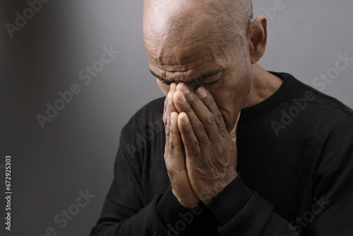 praying to god on gray background with people stock image stock photo