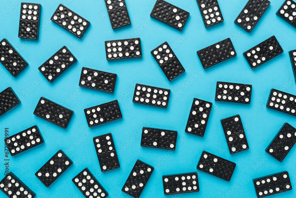 Black domino tiles on color background, top view Black domino tiles on color background, top view