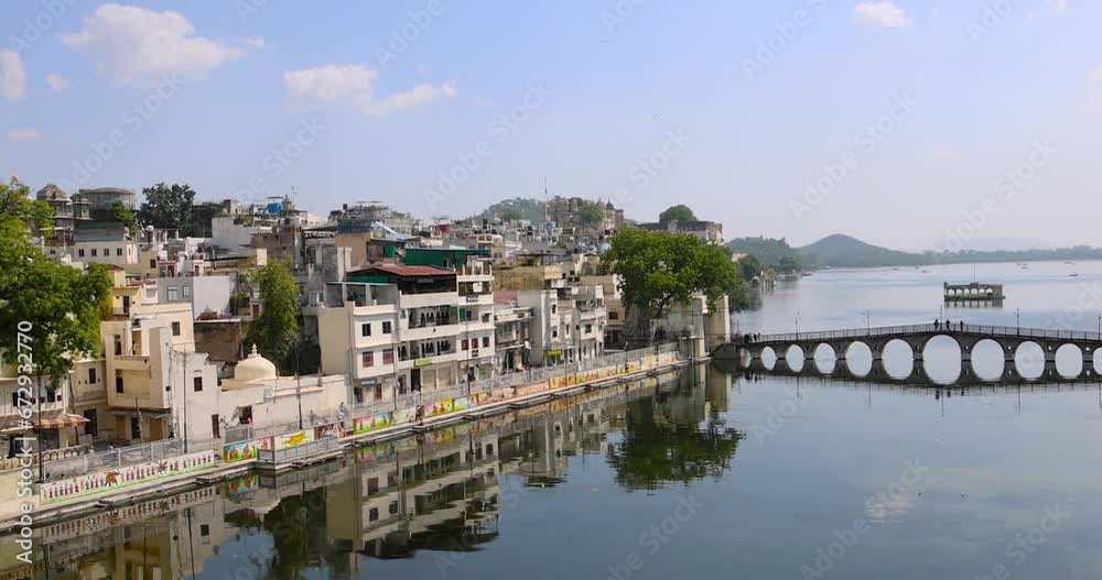 Exterior view of 400 year old historic City palace and other historic buildings along Lake Pichola in Udaipur city, Rajasthan, India Exterior view of 400 year old historic City palace and other historic buildings along Lake Pichola in Udaipur city, Rajasthan, India