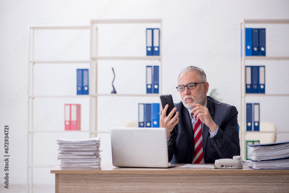 Old male employee and too much work in the office