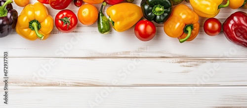 White wooden boards adorned with delicious bell peppers and ripe tomatoes