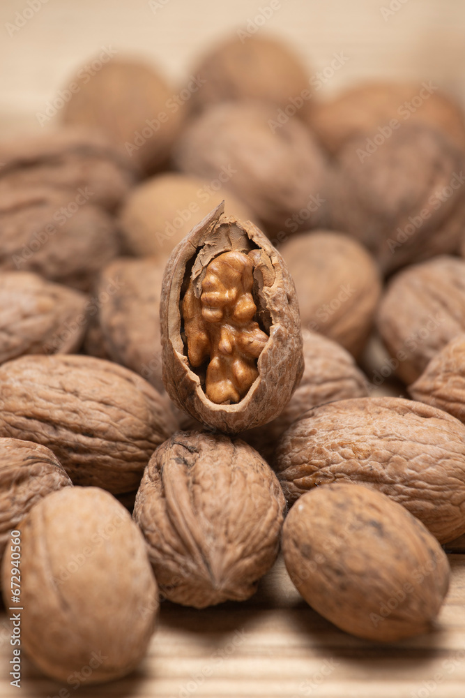 Walnut kernels and whole walnuts. Walnut kernels and whole walnuts.