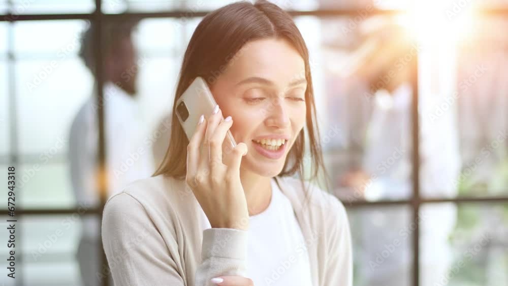 Businesswoman with phone in modern office
