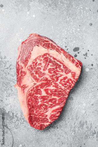 Japanese wagyu rib eye beef meat steak. Gray background. Top view