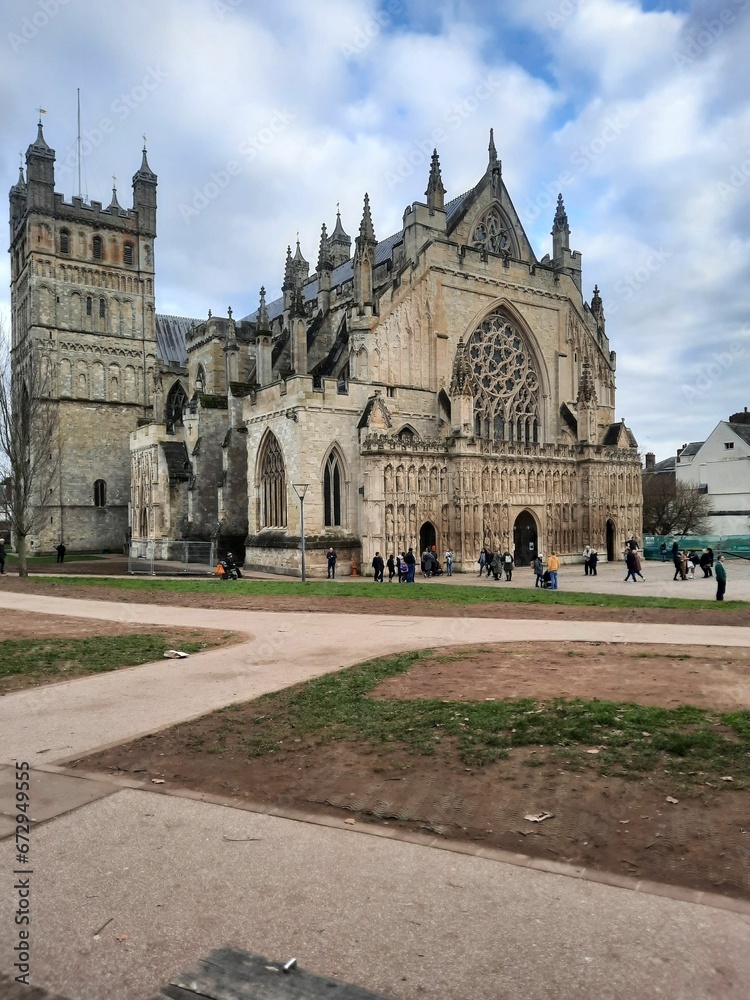 Vertical shot of the gothic Exeter Cathedral on a cloudy day, United Kingdom