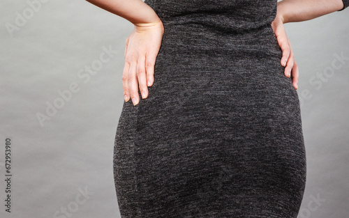 Woman wearing tight dress, back view photo