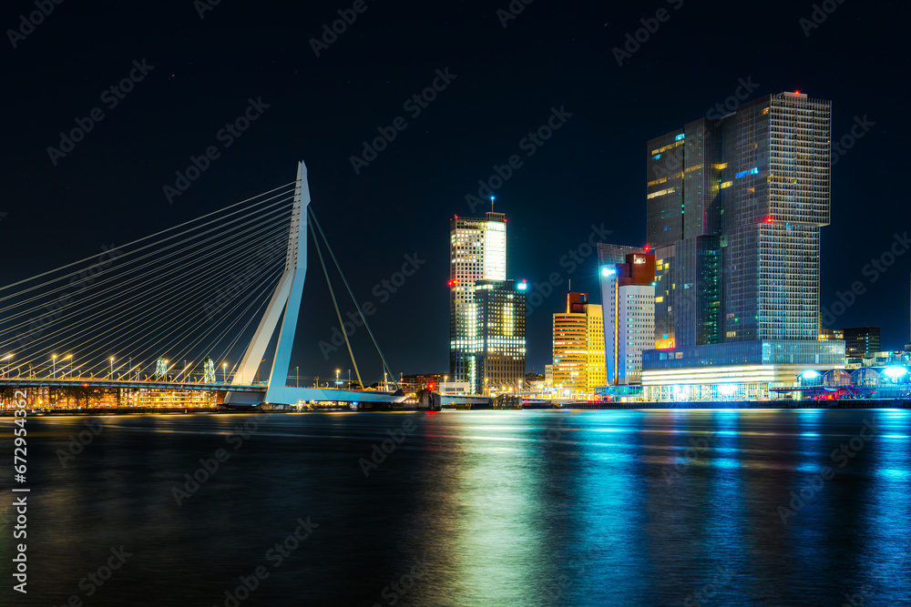 Fototapeta premium Spectacular Night View of Rotterdam from the Sea: Experience the Beauty of the City at Night.