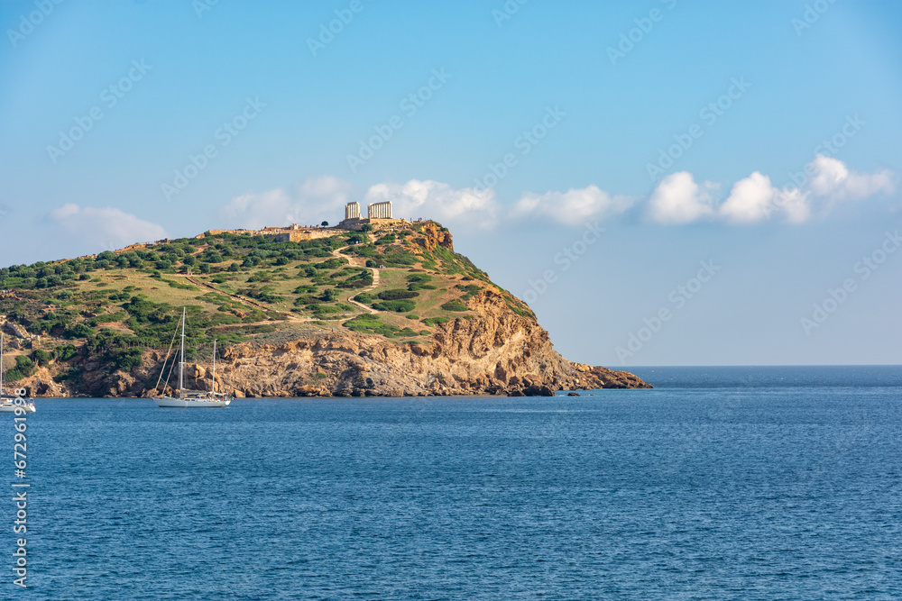 Cape Sounion in Attica, Greece, turquoise Aegean Sea, ancient Temple of Poseidon, rocky cliffs