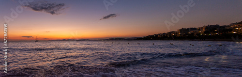 Sunset over Glyfada beach in Athens  Attica  Greece - twilight over Aegean Sea