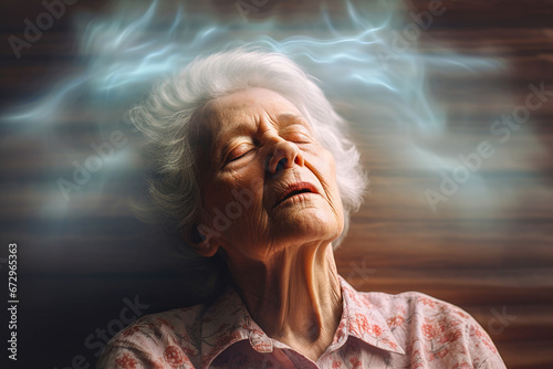 The gray-haired woman faints from pain. Headache, ringing in the ears, blood pressure. Precursors of stroke. photo