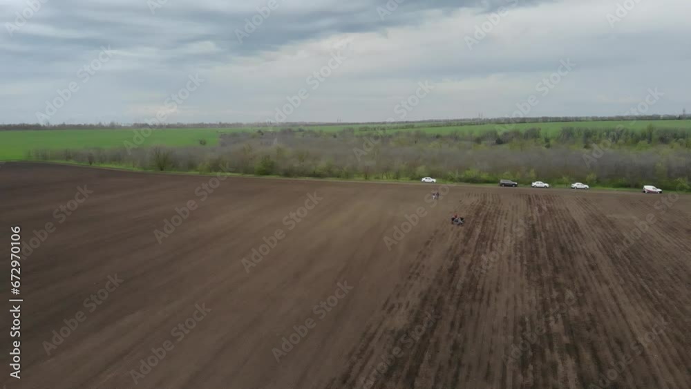 Tractor On The Field Planting Sunflower in Ukraine Tractor On The Field Planting Sunflower in Ukraine