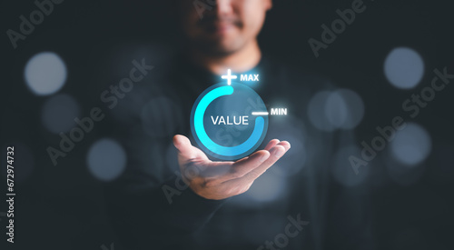 Businessman holding virtual process icon progress for increasing value added to business product and service concept.