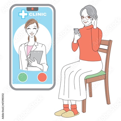 スマートフォンでオンライン診療を受けるシニア女性