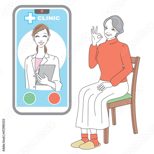 スマートフォンでオンライン診療を受けるシニア女性