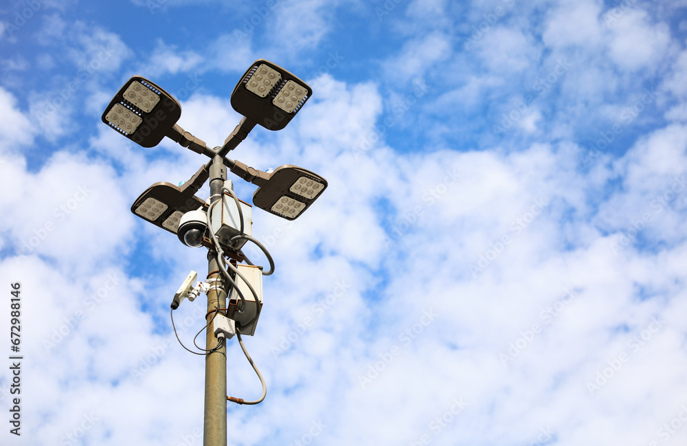 surveillance camera on a city street, symbolizing security and monitoring, framed against an urban backdrop with a neutral tone surveillance camera on a city street, symbolizing security and monitoring, framed against an urban backdrop with a neutral tone