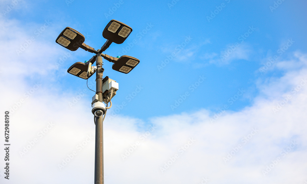 surveillance camera on a city street, symbolizing security and monitoring, framed against an urban backdrop with a neutral tone