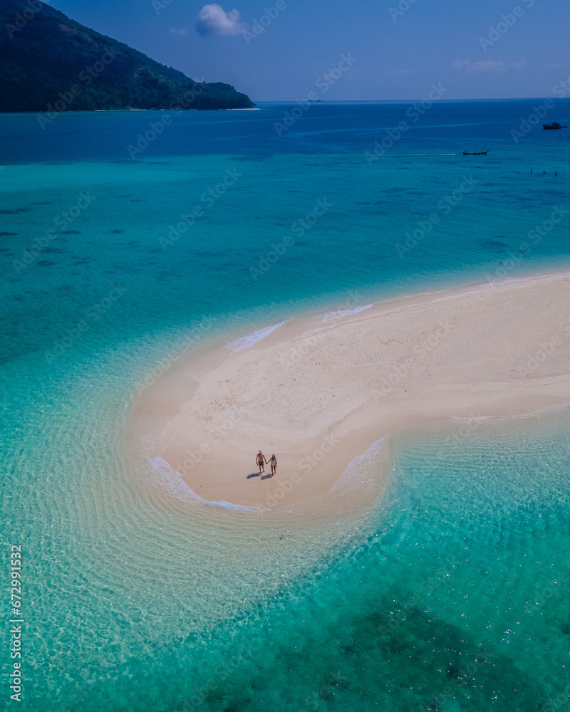Koh Lipe Island Southern Thailand with turqouse colored ocean and white sandy beach at Ko Lipe