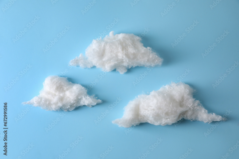 Clouds made of cotton on light blue background Clouds made of cotton on light blue background