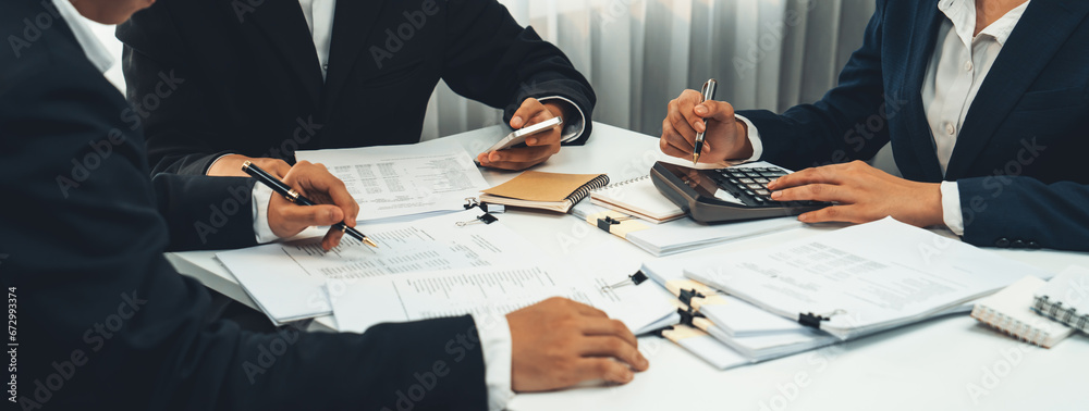 Corporate accountant team use calculator to calculate and maximize tax refunds and improve financial performance based on financial data report. Modern business accounting in panorama. Shrewd - obrazy, fototapety, plakaty 