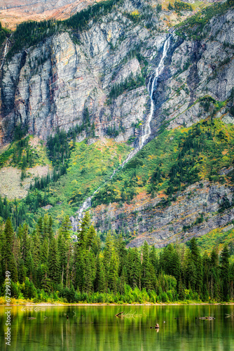 Avalanche Basin cliffs, Avalanche Creek and Monument Falls waterfall in Glacier National Park, Montana. Avalanche Lake is southwest of Bearhat Mountain and receives meltwater from Sperry Glacier. photo