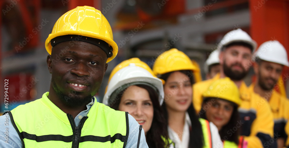 Obraz premium engineer team or worker team with safety uniform standing at industry.