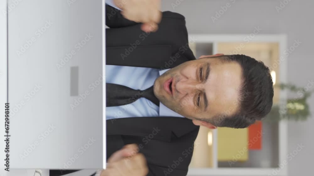 Vertical video of Home office worker man experiencing joy. Vertical video of Home office worker man experiencing joy.