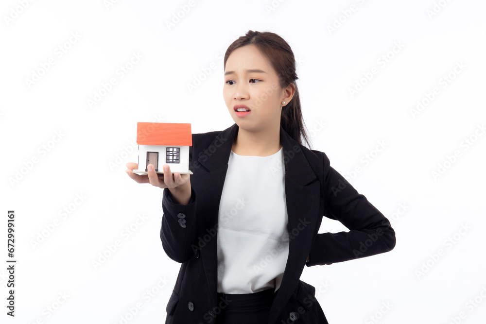Portrait young asian businesswoman unhappy about loan of montage home isolated white background, expression and emotion, business woman annoyed and worried with debt house, stress and depressed. Portrait young asian businesswoman unhappy about loan of montage home isolated white background, expression and emotion, business woman annoyed and worried with debt house, stress and depressed.