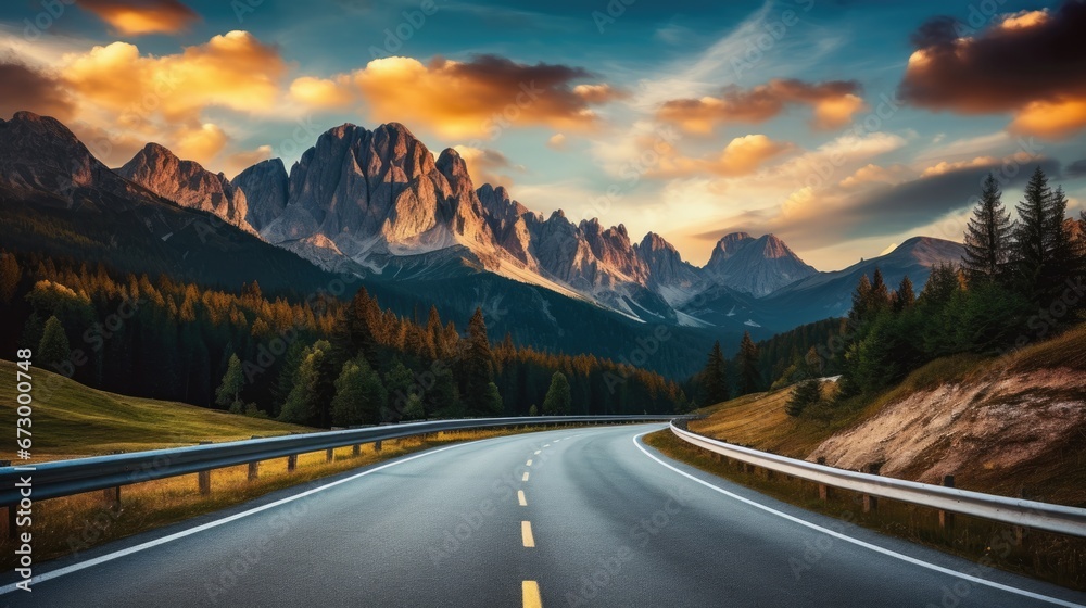 Mountain road at sunset. Beautiful curved roadway. Landscape with empty highway through the mountain.