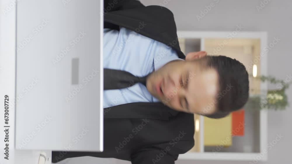 Vertical video of Home office worker man experiencing joy looking at camera. Vertical video of Home office worker man experiencing joy looking at camera.