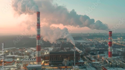 Aerial view of heating plant and thermal power station. Combined modern power station for city district heating and generating electrical power. Industrial zone from above. photo