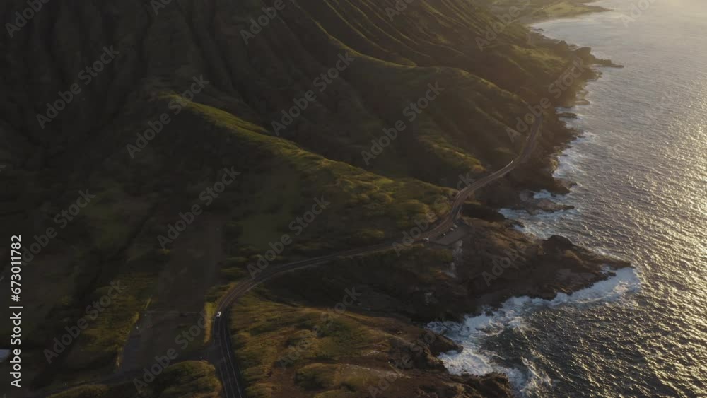 Aerial view of coastal road and coastline at sunrise, Oahu island, Hawaii