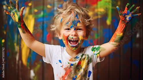 happy child playing with paint