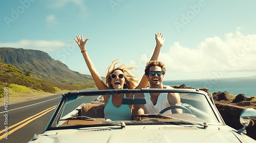Happy couple driving a convertible on the seaside road