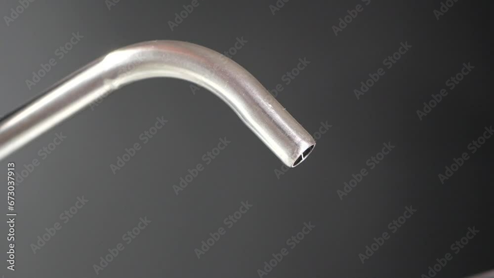  water pouring from a faucet tap in a glass, drinking pure water concept 