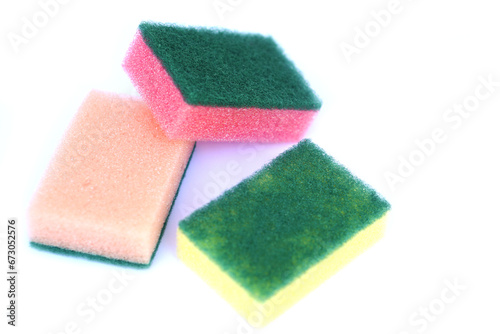 Soft cleaning sponge for washing dishes, isolated in white background. Concept, useful equipment for cleaning, scrubbing dish in kitchen or use for other purposes. Household tool.                     