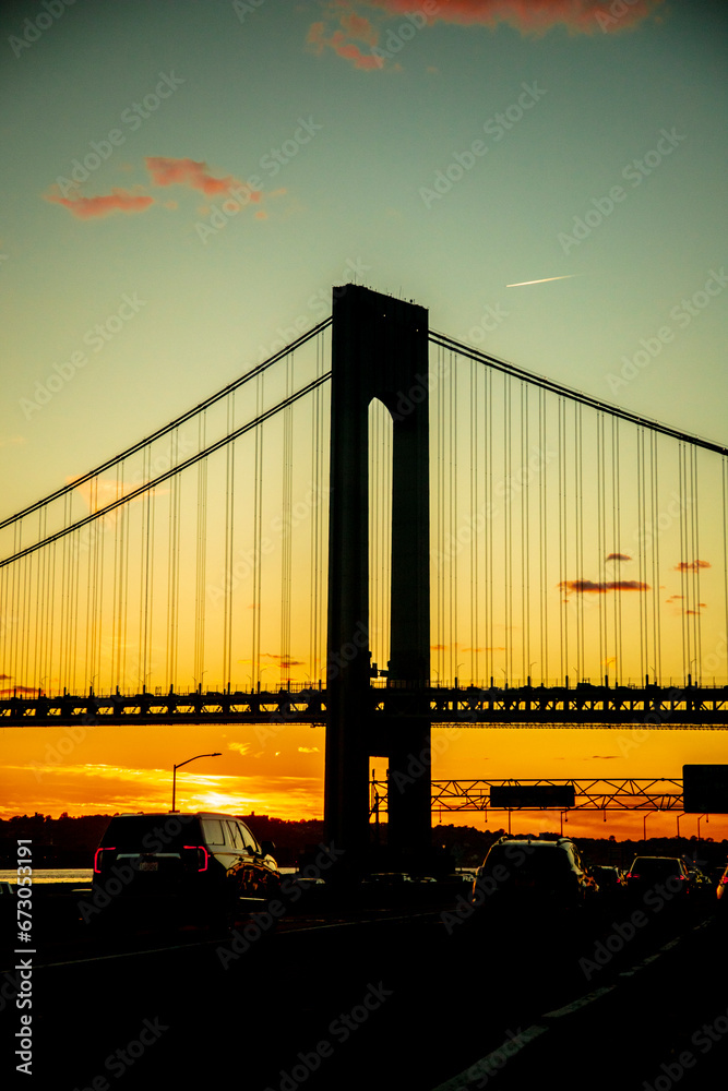 Fototapeta premium Sunset in Traffic with bridge & clouds