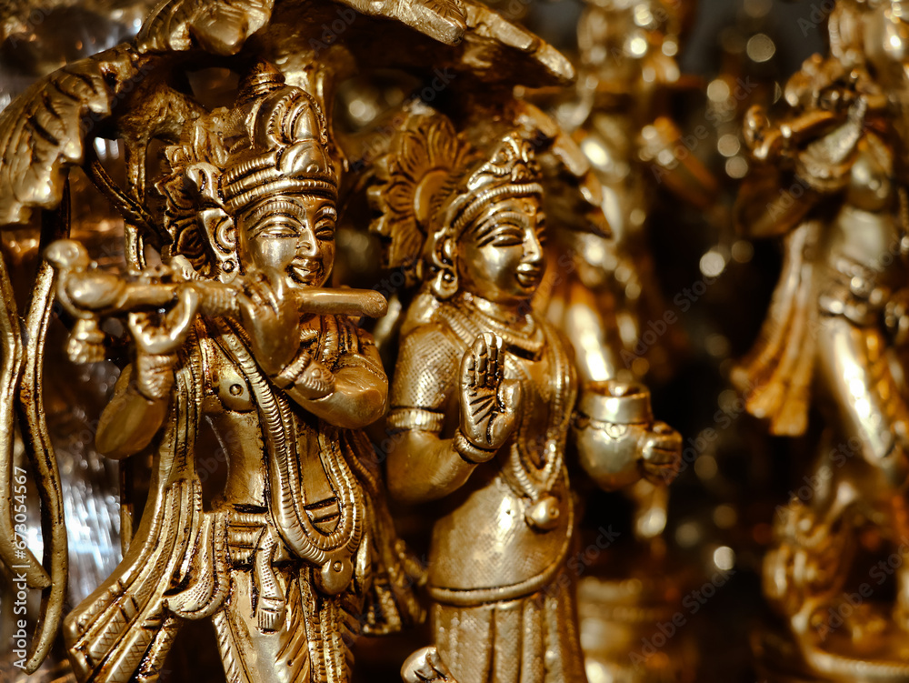closeup of hindu god lord krishna and radha sculpture in an antique store for vintage idols and gifts