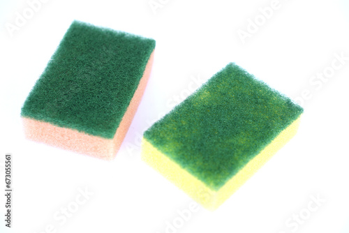 Soft cleaning sponge for washing dishes, isolated in white background. Concept, useful equipment for cleaning, scrubbing dish in kitchen or use for other purposes. Household tool.                     