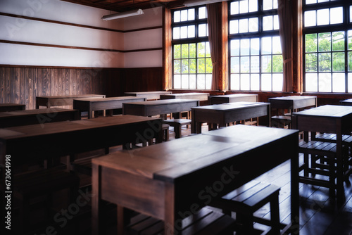 木造校舎の教室に並ぶ机 photo