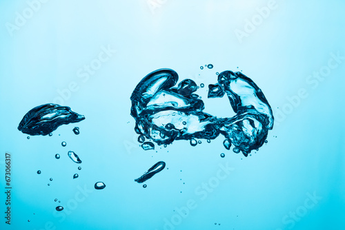 Big air bubble are rising in the blue water , air bubble isolated on blue background.	