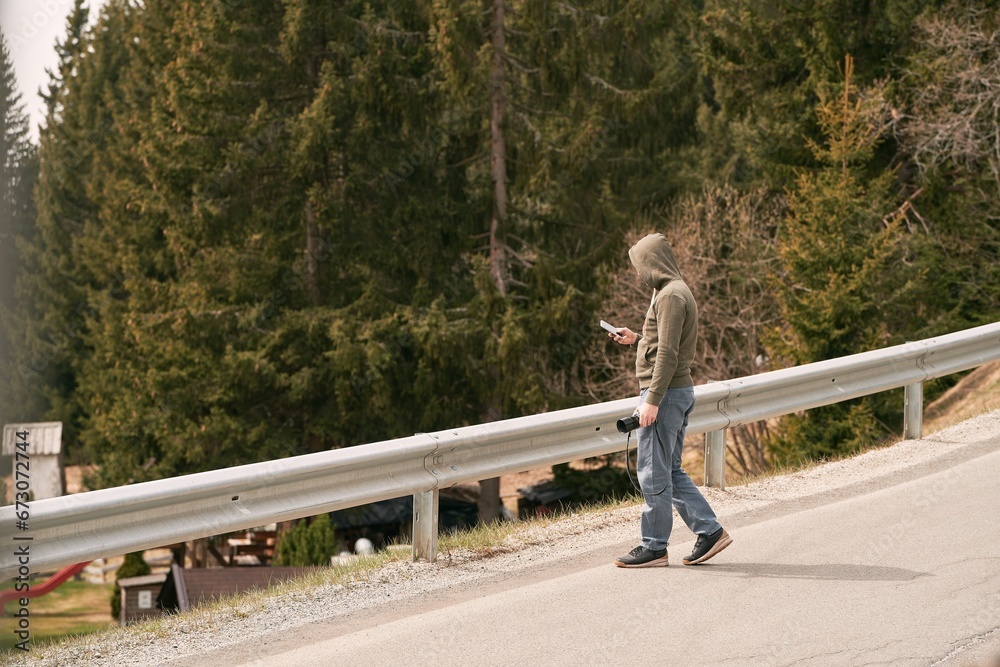 Photogrpaher in Alps. A male photographer in the beautiful Alpine mountains Photogrpaher in Alps. A male photographer in the beautiful Alpine mountains