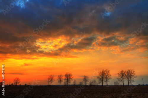 Landscape sundown in river valley  Poland Europe  amazing red sky and trees autumn time Poland Europe