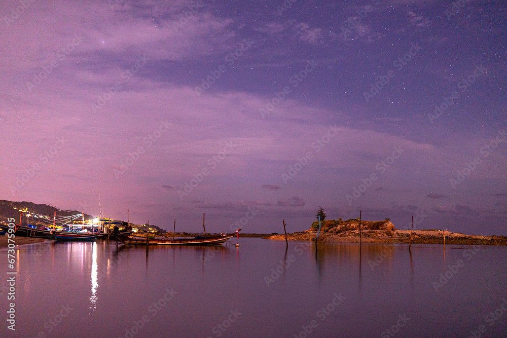 Summer beach with blue water and purple sky at the sunset. Summer beach with blue water and purple sky at the sunset.