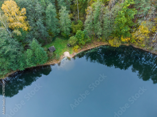 Aerial view of a lake in the forests of Lithuania  wild nature. Rest area  bathing area.