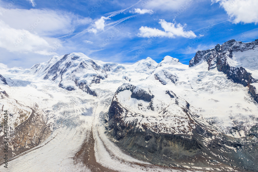 Magnificent panorama of the Pennine Alps with famous Gorner Glacier and impressive snow capped mountains Monte Rosa Massif close to Zermatt, Switzerland Magnificent panorama of the Pennine Alps with famous Gorner Glacier and impressive snow capped mountains Monte Rosa Massif close to Zermatt, Switzerland