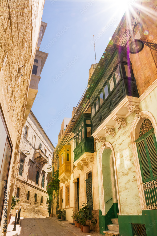 Closed and typical Maltese balconies called gallarija and sunbeams