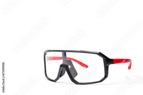 Cycling glasses for sports, unisex, plastic, with red temples.