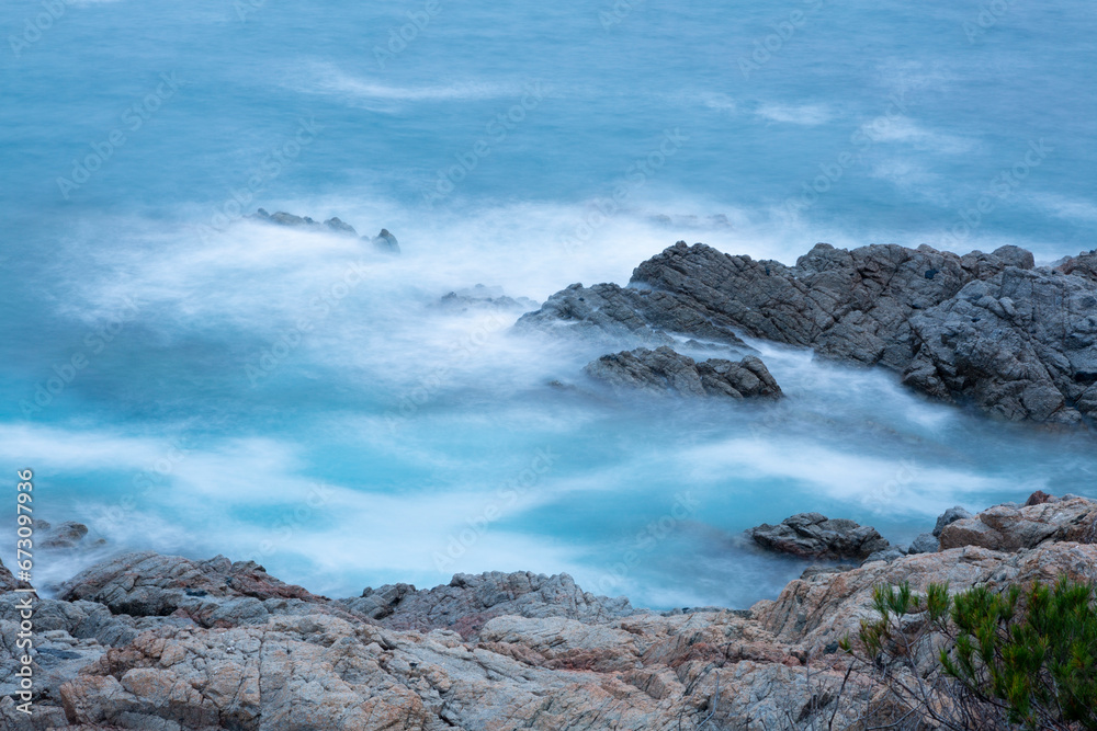 the sea crashing against the rocks the sea crashing against the rocks