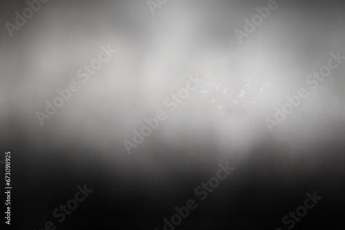Blurry black, dark gray, silver and white color gradient. Grain, noise effect. Abstract background, banner, wide. Design. Pattern, color palette. Gradient. Spectrum. Shades of dark colors